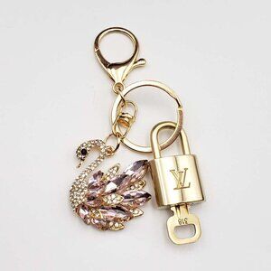 Louis Vuitton Gold Padlock & Pink Crystal Swan Keychain